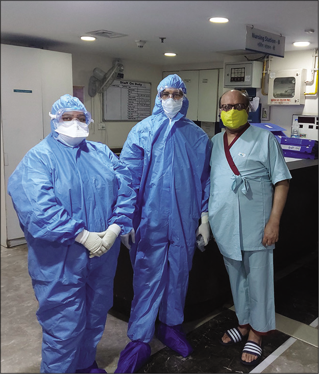 Myself with the treating physician and the nurse (both wearing Personal Protection Equipment).